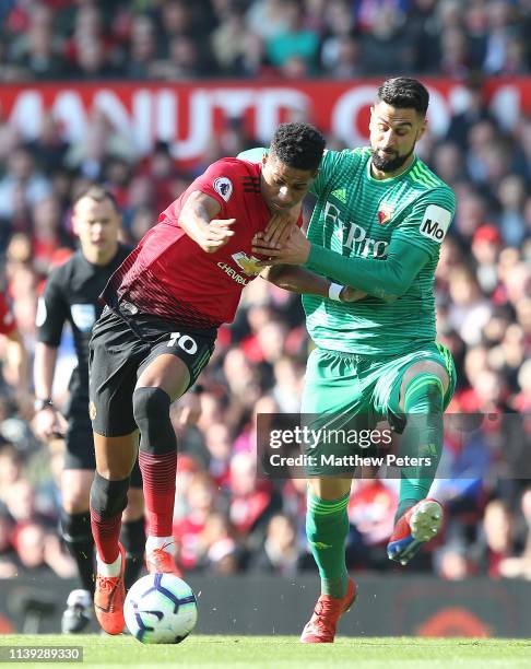 Marcus Rashford of Manchester United in action with Miguel Britos of Watford during the Premier League match between Manchester United and Watford FC...