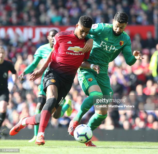 Marcus Rashford of Manchester United in action with Miguel Britos of Watford during the Premier League match between Manchester United and Watford FC...