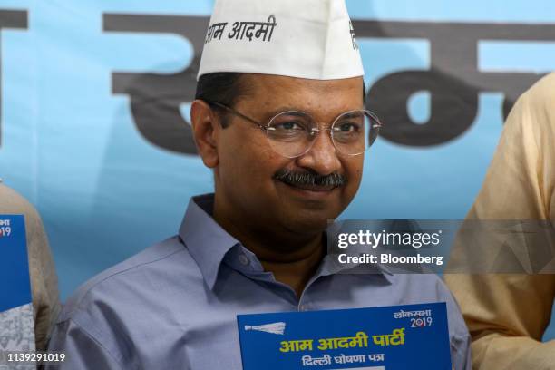 Arvind Kejriwal, leader of the Aam Aadmi Party and chief minister of Delhi, poses for a photograph during an event marking the release of the AAP...