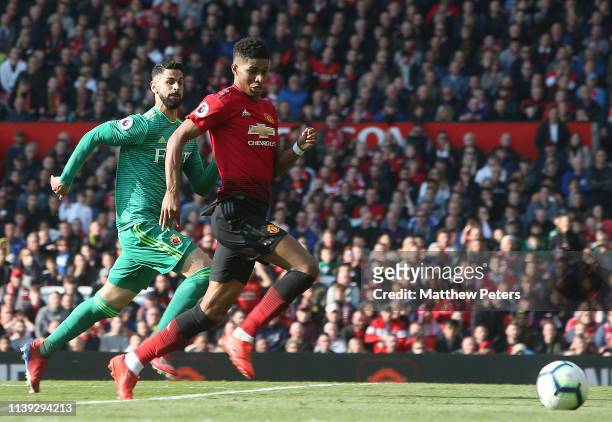Marcus Rashford of Manchester United in action with Miguel Britos of Watford during the Premier League match between Manchester United and Watford FC...