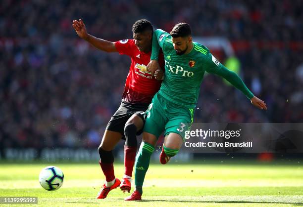 Marcus Rashford of Manchester United battles for possession with Miguel Britos of Watford during the Premier League match between Manchester United...