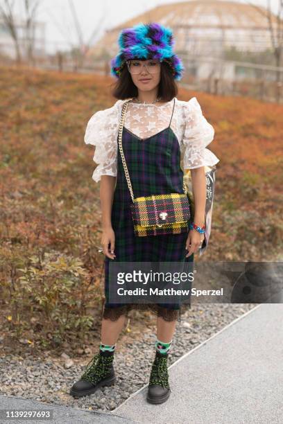 Guest is seen on the street attending Labelhood during Shanghai Fashion Week A/W 2019/2020 wearing blue/purple faux fur top-hat, white lace star...