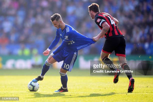 Dan Gosling of AFC Bournemouth holds onto the shirt of James Maddison of Leicester City during the Premier League match between Leicester City and...