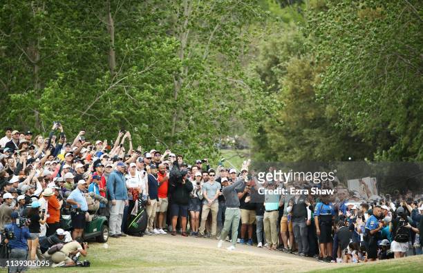 Tiger Woods of the United States plays his second shot on the 15th hole during the fourth round of the World Golf Championships-Dell Technologies...