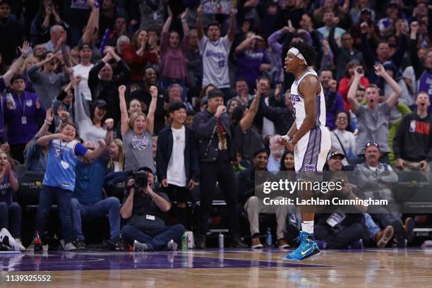 De'Aaron Fox of the Sacramento Kings celebrates after a basket against the Phoenix Suns at Golden 1 Center on March 23, 2019 in Sacramento,...