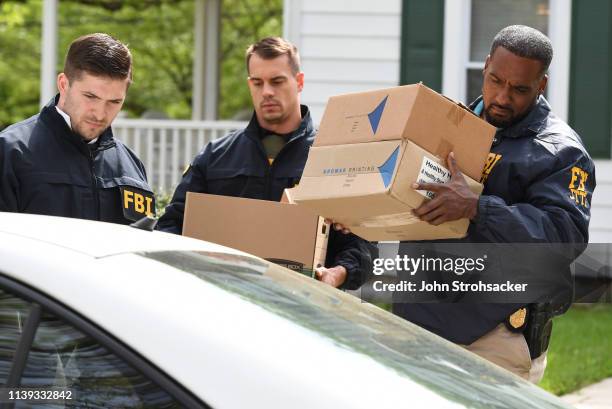 Federal agents remove items from the home of Baltimore Mayor Catherine Pugh in the 3400 block of Ellamont Rd as they execute a search warrant, on...