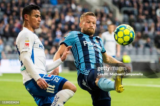 Nicklas Barkroth of Djurgardens IF in a duel with Ian Smith of IFK Norrkoping during the Allsvenskan match between Djurgardens IF and IFK Norrkoping...