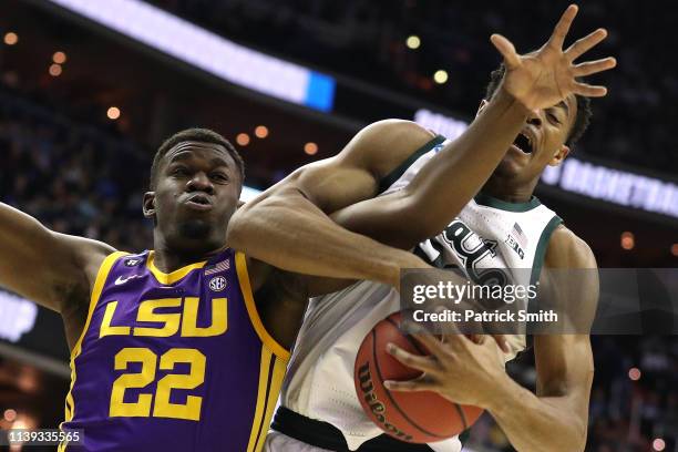 Xavier Tillman of the Michigan State Spartans rebounds against Darius Days of the LSU Tigers during the first half in the East Regional game of the...