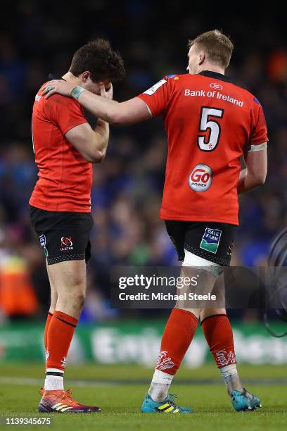 Jacob Stockdale of Ulster is consoled at the final whistle by Kieran Treadwell during the Heineken Champions Cup Quarter-Final match between Leinster...