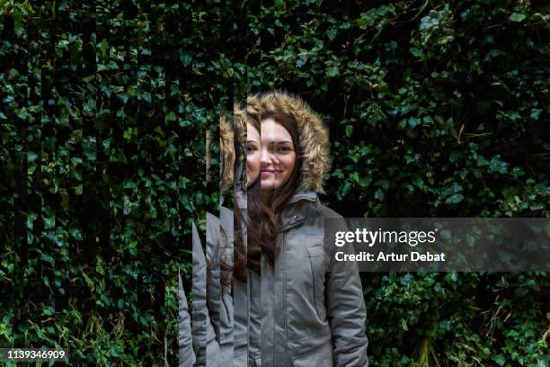 surreal rearranged strips picture of a portrait of beautiful woman with green wall. - distorted image fotografías e imágenes de stock