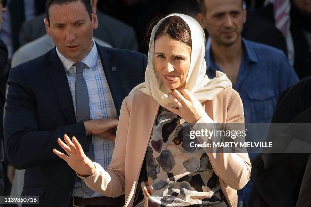 New Zealand Prime Minister Jacinda Ardern wearing a head scarf leaves the Al Noor Mosque after a speaking event with Britain's Prince William , in...