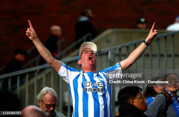 Huddersfield Town fans cheer their team on during the Premier League match between Crystal Palace and Huddersfield Town at Selhurst Park on March 30,...