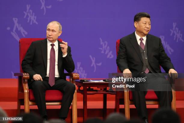 Russian President Vladimir Putin, left, and Chinese President Xi Jinping, right, attend the Tsinghua Universitys ceremony, at Friendship Palace on...