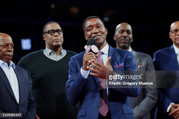 Former Detroit Piston Isiah Thomas talks to the crowd during a celebration of the 1989 and 1990 World Championship Detroit Pistons at halftime during...