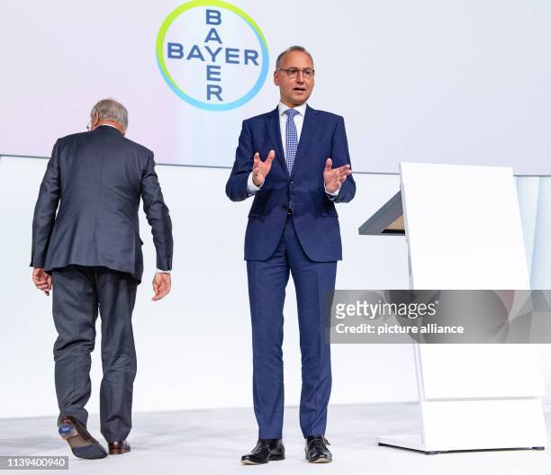 April 2019, North Rhine-Westphalia, Bonn: Werner Baumann , Chairman of the Board of Management of Bayer AG, is standing on stage at the Bayer Annual...