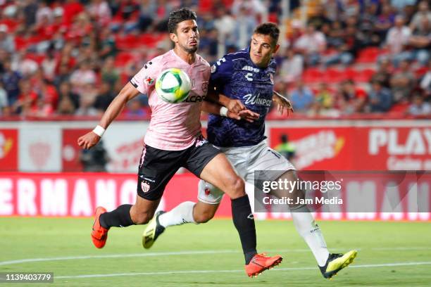 Eduardo Herrera of Necaxa fights for the ball with Edson Garcia of Veracruz during the 12th round match between Necaxa and Veracruz as part of the...