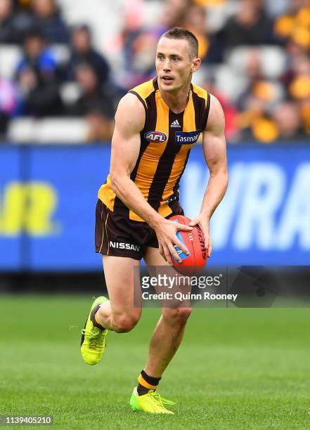 Tom Scully of the Hawks kicks during the round two AFL match between the Hawthorn hawks and the Western Bulldogs at Melbourne Cricket Ground on March...