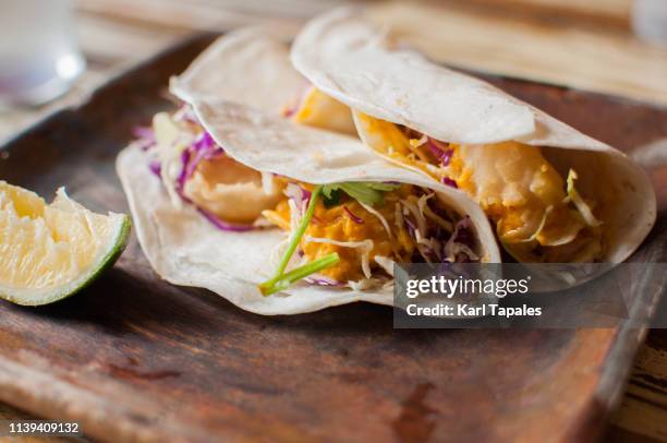 salted egg shrimp in flour tortilla - salted egg chips stock pictures, royalty-free photos & images