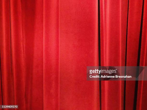 red velvet curtain - red velvet material stock-fotos und bilder