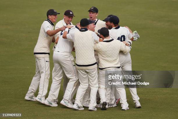 Victoria players celebrate the winning wicket during day four of the Sheffield Shield Final match between Victoria and New South Wales at Junction...