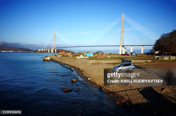 Picture taken on April 26, 2019 shows the Russky Island bridge over the Eastern Bosphorus Strait in the far-eastern Russian port of Vladivostok. -...