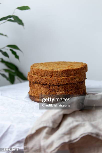 delicious sliced carrot cake on white background with copy space - carrot cake stock pictures, royalty-free photos & images