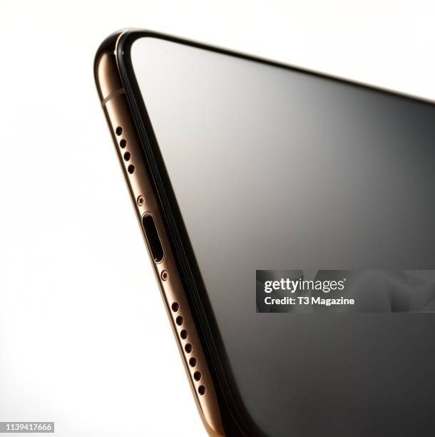 Detail of the speakers and Lightning port on an Apple iPhone XS Max smartphone with a Gold finish, taken on September 25, 2018.