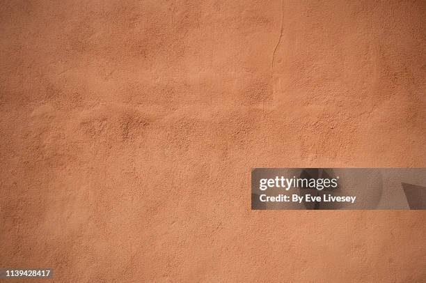 stippled plaster wall background - spanish wall texture stock pictures, royalty-free photos & images