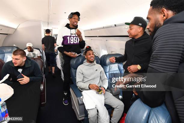 Nikola Jokic, Torrey Craig, Monte Morris, Isaiah Thomas and Will Barton of the Denver Nuggets talk on a plane ride to San Antonio on April 24, 2019...