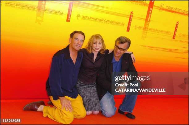 61st Venice Film Festival. Photo call of "Land of Plenty" In Venice, Italy On September 09, 2004-Michelle Williams, Wim Wenders, John Diehl.