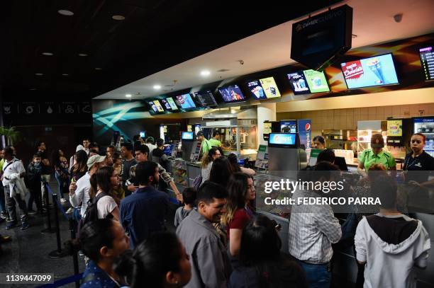 Venezuelan filmgoers buy popcorn to watch the first screening in Venezuela of Marvel Studios' "Avengers: Endgame" at a cinema in Caracas on early...