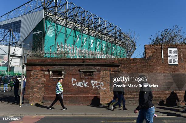 Graffiti is written on the wall outside the stadium ahead of the Ladbrokes Scottish Premiership match between Celtic and Rangers at Celtic Park on...