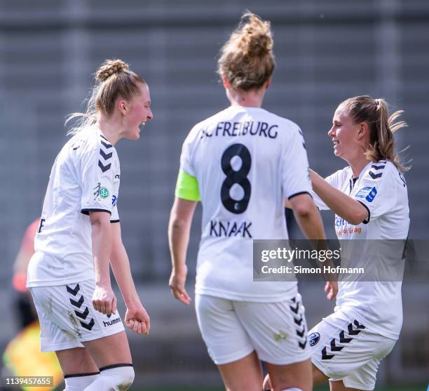 Janina Minge of Freiburg celebrates her team's first goal with her team mates during the Women's DFB Cup Semi Final between TSG Hoffenheim and SC...