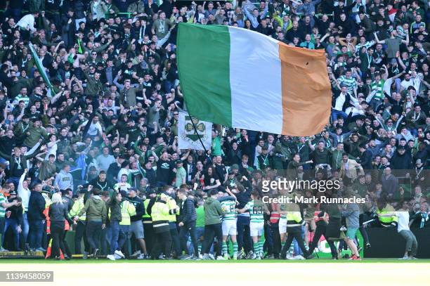 Odsonne Edouard of Celtic celebrates with the fans after he scores his sides first goal but is given a yellow card for causing a pitch invasion...