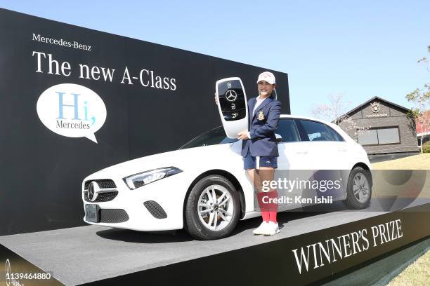 Yui Kawamoto of Japan poses for photos after winning the AXA Ladies Golf Tournament at the UMK Country Club on March 31, 2019 in Miyazaki, Japan.