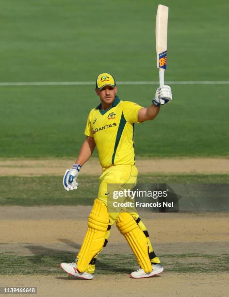 Aaron Finch of Australia celebrates after reaching his half century during the 5th One Day International match between Pakistan and Australia at...