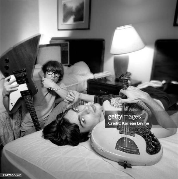 Rivers Cuomo and Brian Bell relax at their hotel before a Weezer show on August 26, 1994 in New York City, New York.