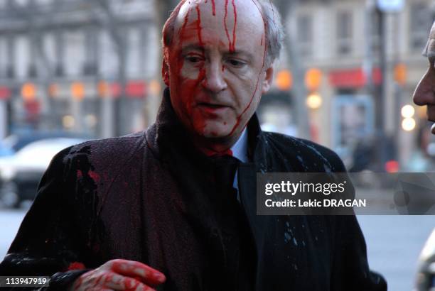 Hubert Vedrine victim of the collective 'Genocide Made in France' In Paris, France On November 28, 2007-Hubert Vedrine, was sprinkled of blood this...