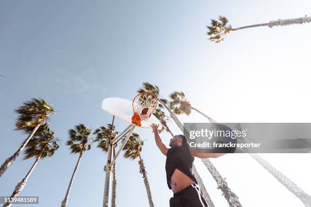 slam dunk in the street court - closeup basketball dunk stock pictures, royalty-free photos & images