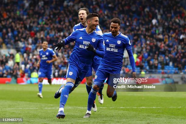 Victor Camarasa of Cardiff City celebrates with his team mates after he score his sides first goal during the Premier League match between Cardiff...
