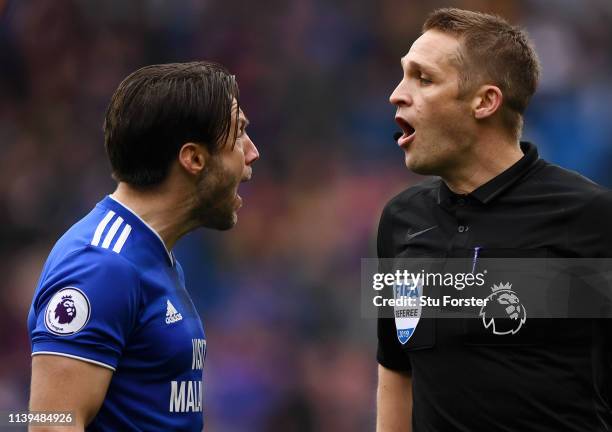Harry Arter of Cardiff City is shown a yellow card by match referee Craig Pawson during the Premier League match between Cardiff City and Chelsea FC...