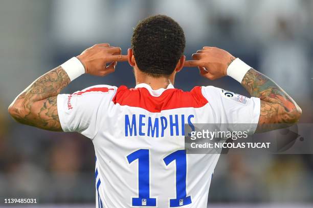 Lyon's Dutch forward Memphis Depay celebrates after scoring a goal during the French L1 football match between Bordeaux and Lyon on April 26, 2019 at...