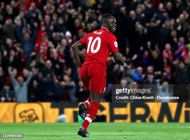 Sadio Mane of Liverpool celebrates scoring his teams second goal during the Premier League match between Liverpool FC and Huddersfield Town at...