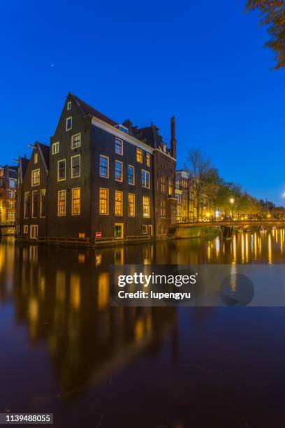 amsterdam house at dusk - amsterdam blue sky stock-fotos und bilder