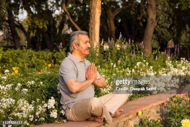 yoga - stock images - senior spirituality stock pictures, royalty-free photos & images