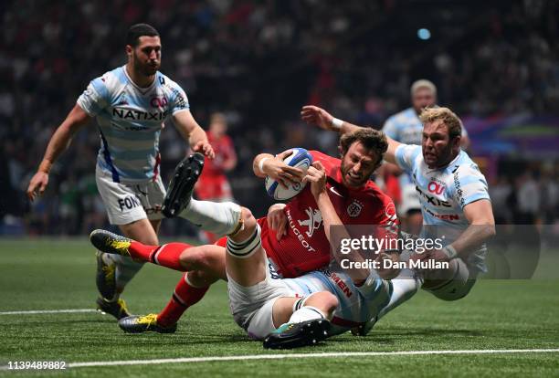 Maxime Medard of Toulouse dives over to score his side's second try during the Heineken Champions Cup Quarter Final match between Racing 92 and...