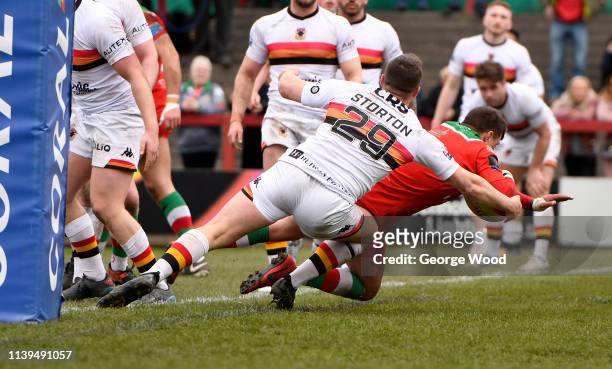 Buster Feather of Keighley Cougars goes over to score the opening try during the Challenge Cup match between Keighley Cougars and Bradford Bulls at...