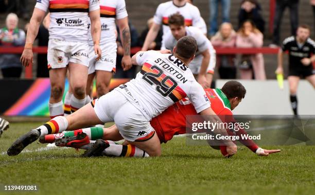 Buster Feather of Keighley Cougars goes over to score the opening try during the Challenge Cup match between Keighley Cougars and Bradford Bulls at...