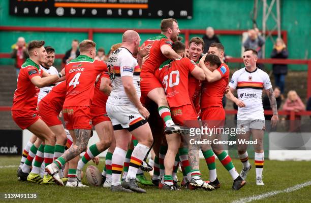 Keighley Cougars players celebrate the opening try scored by Buster Feather during the Challenge Cup match between Keighley Cougars and Bradford...