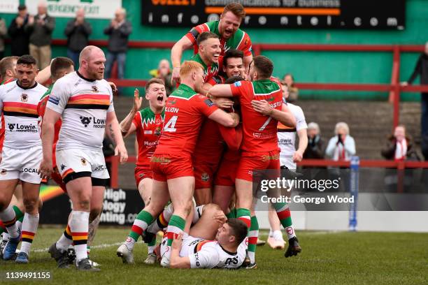 Keighley Cougars players celebrate the opening try scored by Buster Feather during the Challenge Cup match between Keighley Cougars and Bradford...